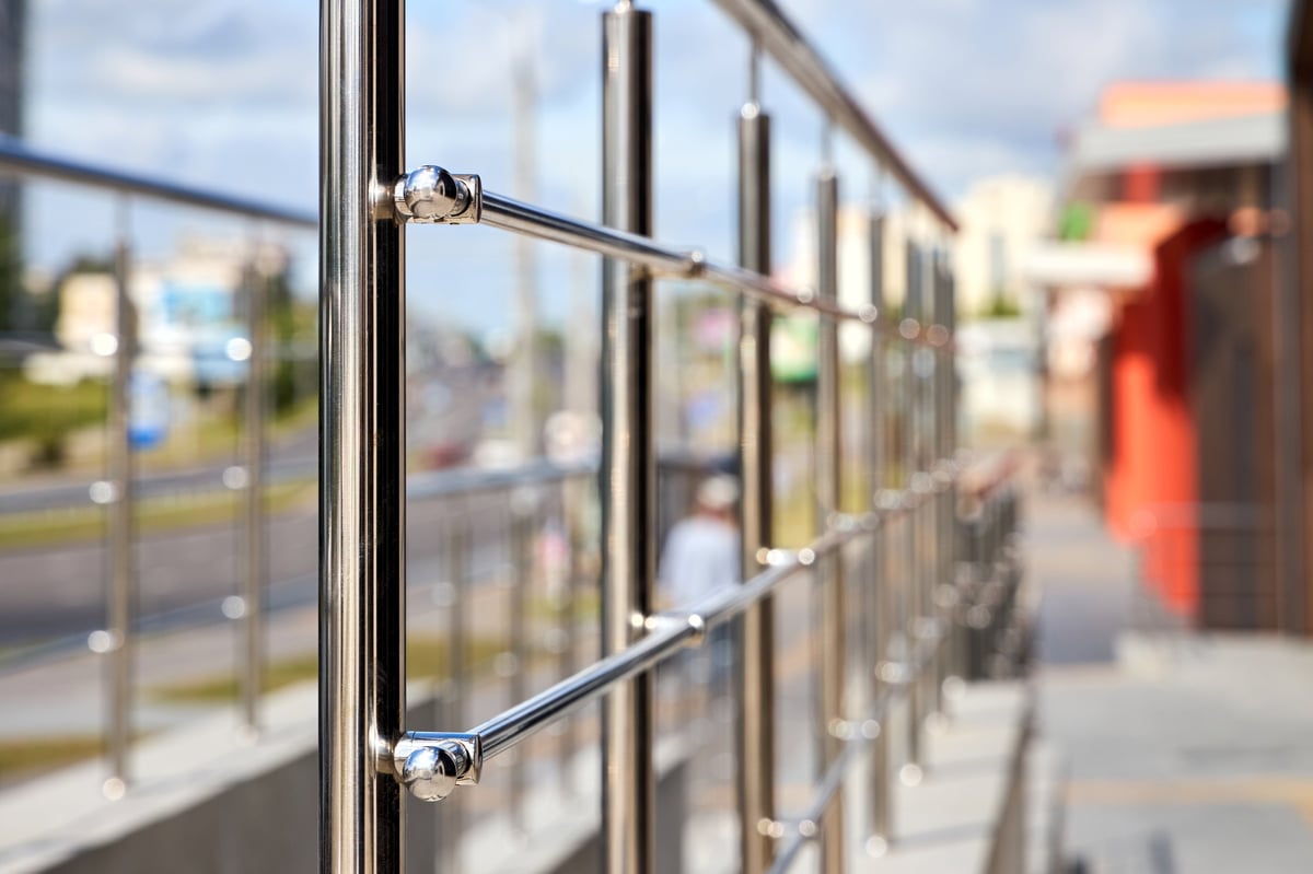 Polished stainless steel railing with sleek handrails and vertical balusters