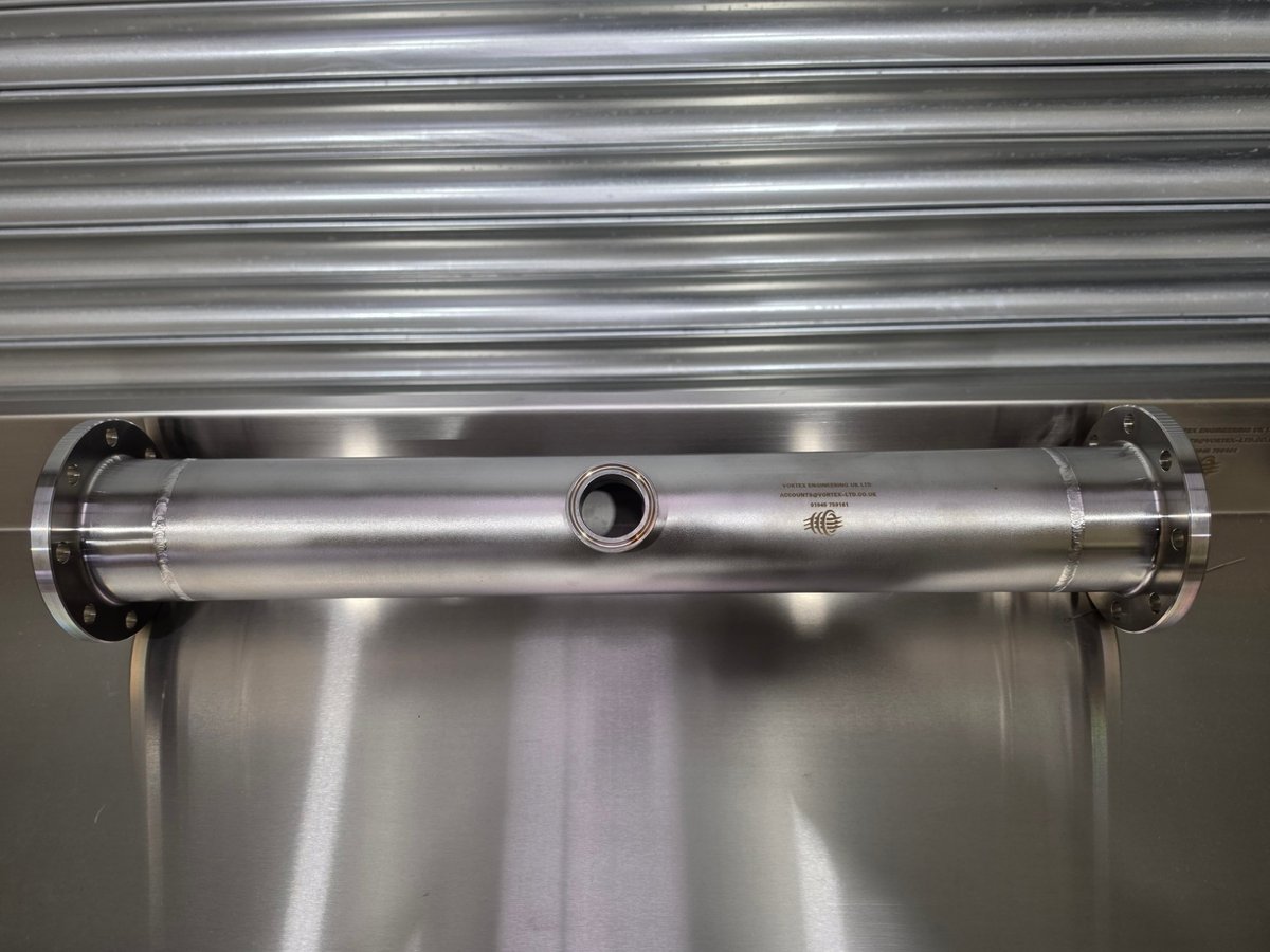 Stainless steel cylindrical tube with flanged ends and a branch welded in, fabricated in the Vortex workshop